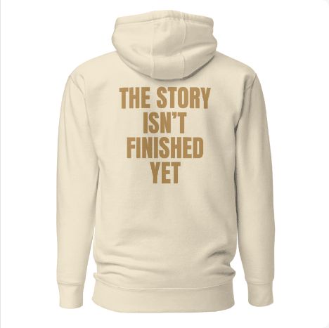 Approved Printful preview: Bone TWIST hoodie with THE STORY ISN’T FINISHED YET raised on the back.